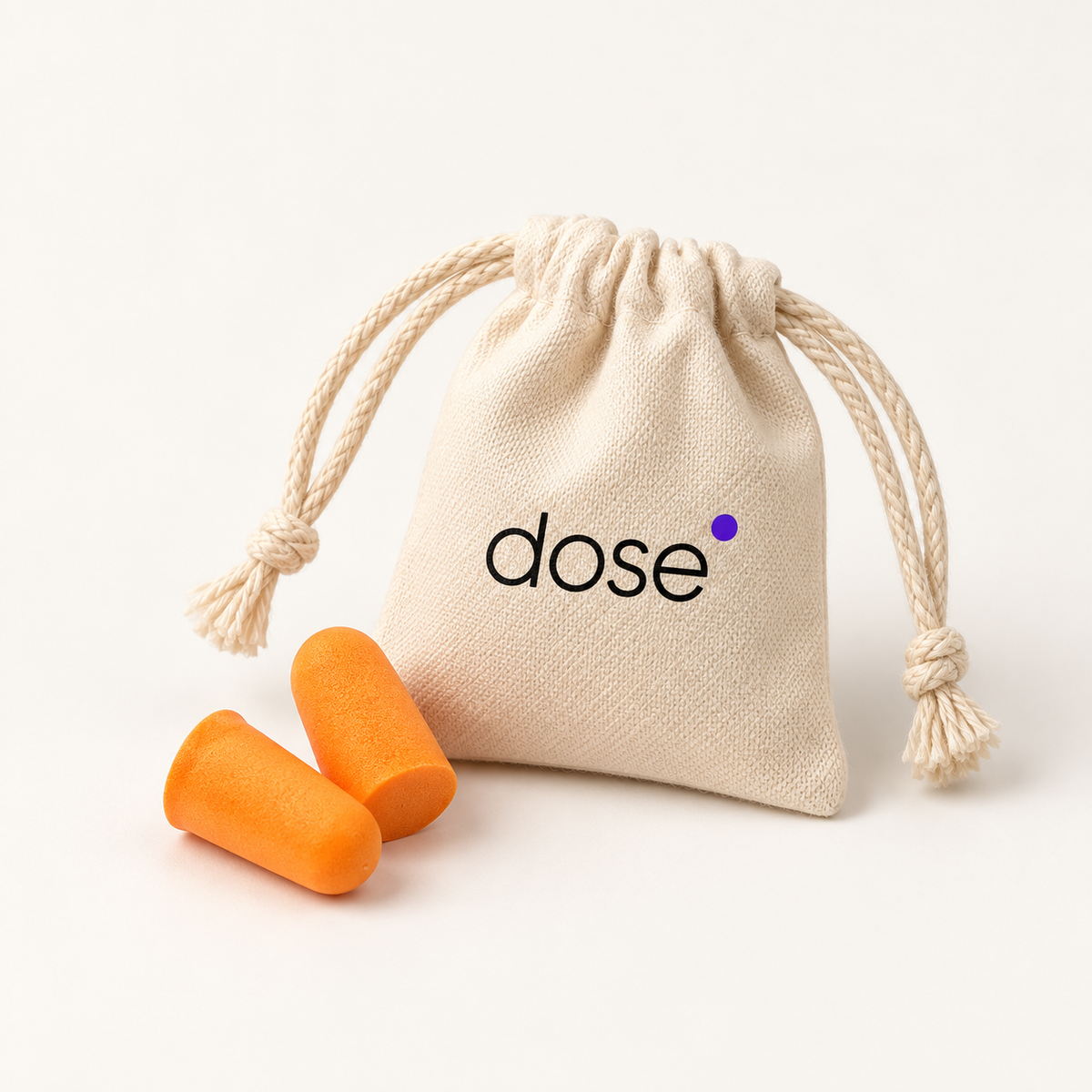 Orange Dose Earplugs and a cotton pouch with the dose logo on a clean light background.